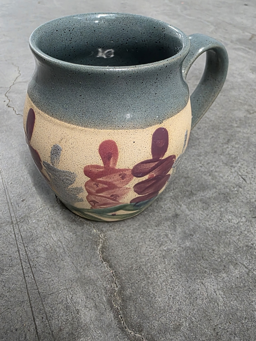 Handcrafted Ceramic Mug with Teal Rim and Floral Motif